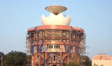Parabolic dish antenna installed atop a building
