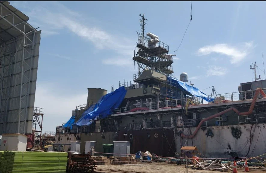 Naval vessel at a shipyard with its RADAR mast under installation